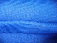 Poliéster con 25% hilo de  cobre , color azul rey, precio  por  kilo